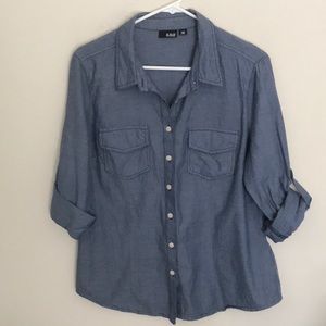 Perfect casual denim style top with tab sleeves and front pockets!